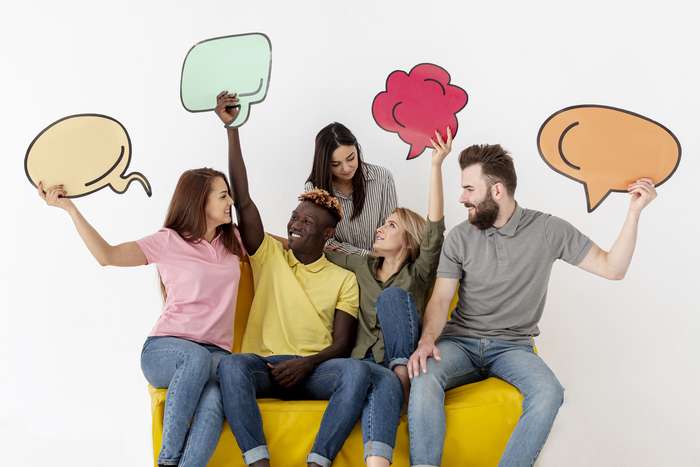 friends-looking-each-other-holding-chat-bubble (1)