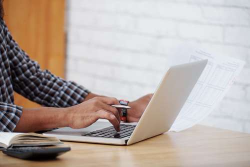 Cropped image of businessman working with financial data